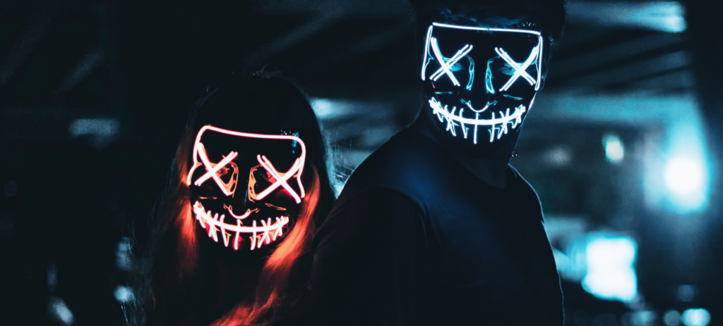 spooky couple with neon lights for faces 