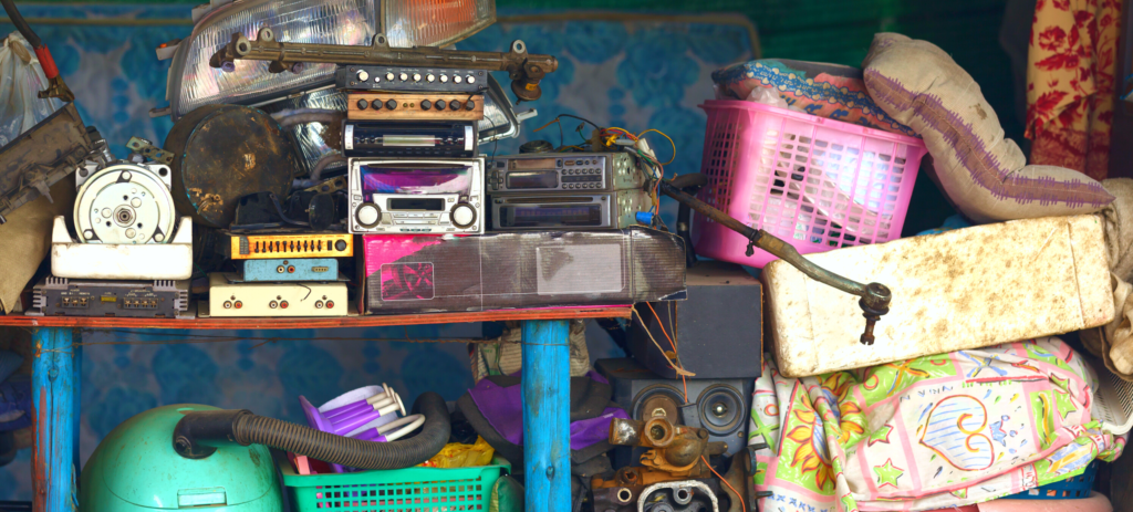 photo of a pile of random hoarded junk in a garage