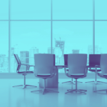 Photo of empty conference with floor-to-ceiling windows