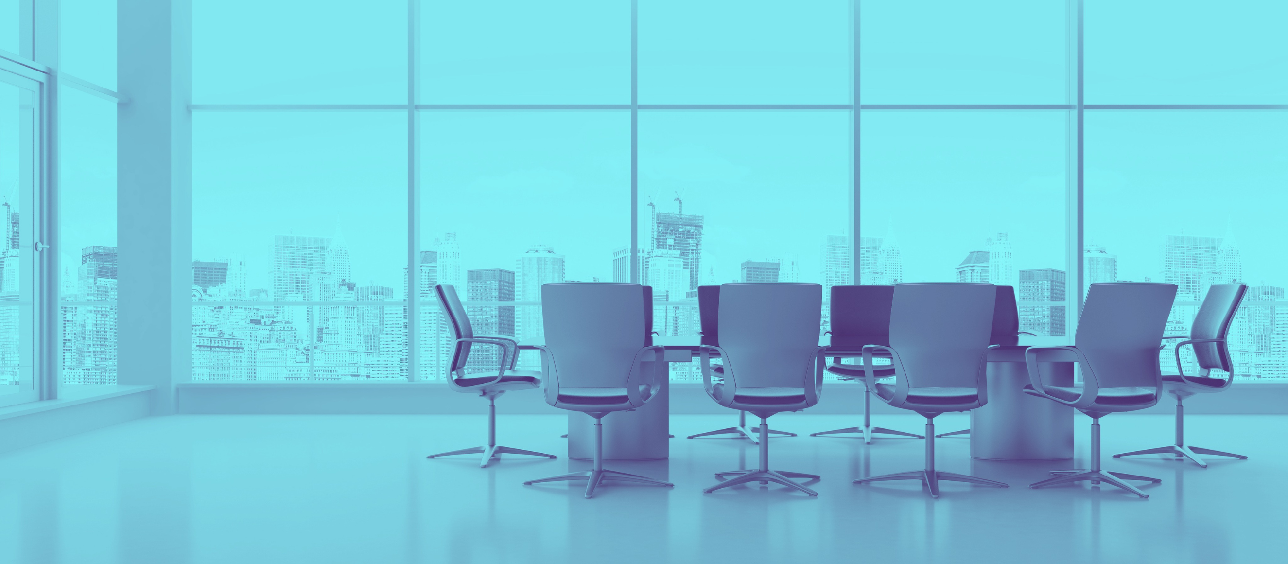 Photo of empty conference with floor-to-ceiling windows